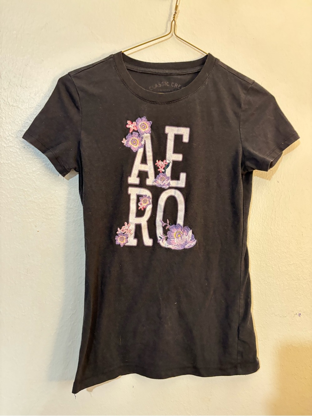 Aeropostale Black Short Sleeve Logo Tee with Purple Floral Accents